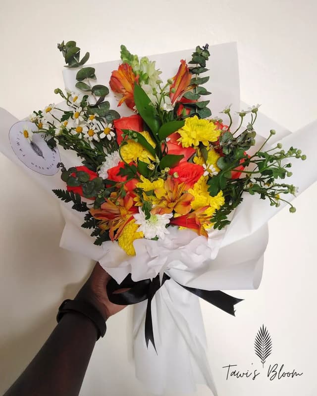 small buckets of flowers
